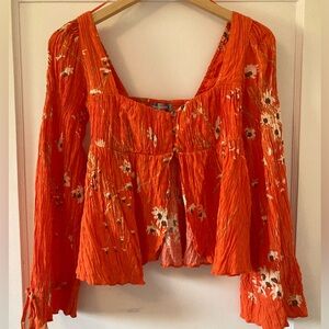 Urban Outfitters Blouse. Size Small. Orange floral design.
